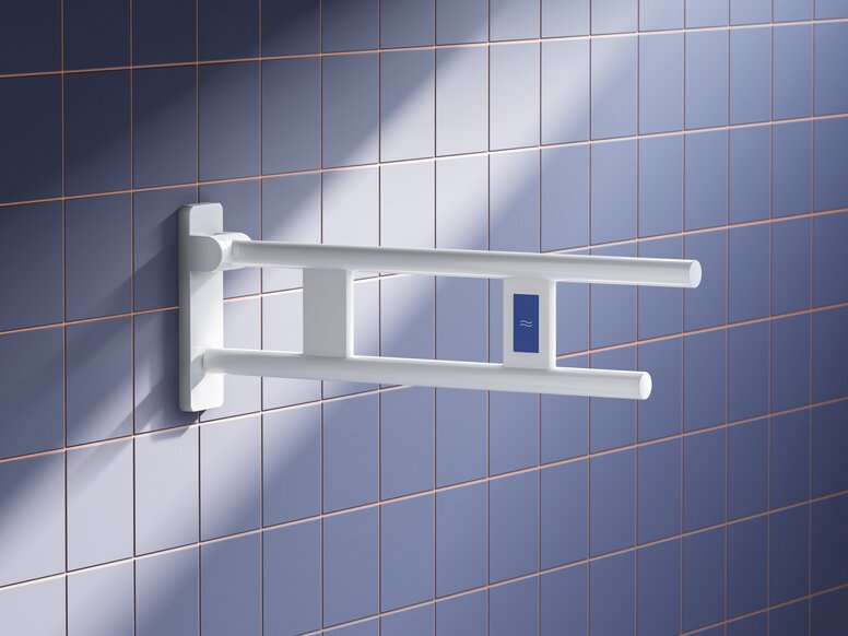 HEWI System 700 hinged support rail White wall-mounted plastic hinged support rail with two parallel tubes and a blue control on a blue tiled wall