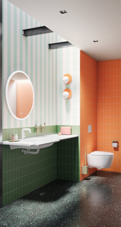 Bathroom open to an adjoining bedroom, with a washbasin, toilet, shower area and green fittings against orange tiles