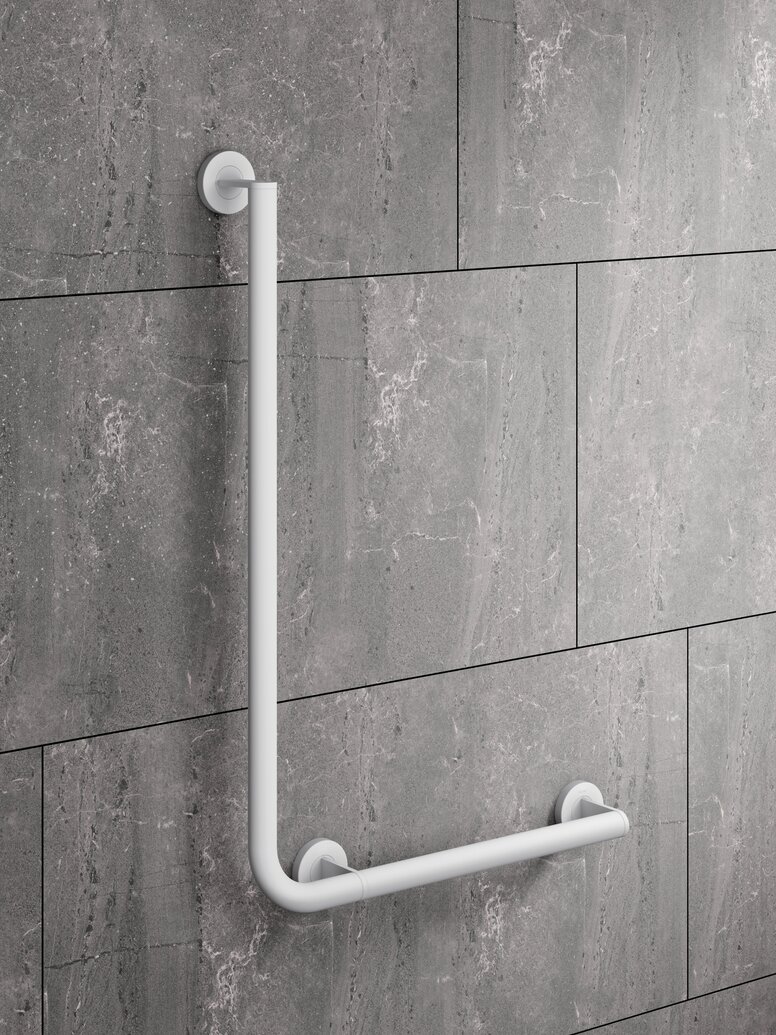 White powder-coated L-shaped support rail on a grey wall