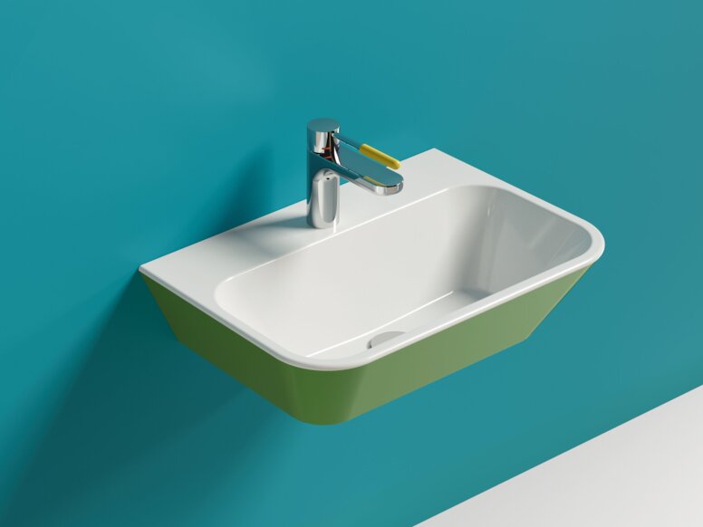 Wandhängendes grünes Waschbecken aus Mineralguss mit eckiger Form und Wasserhahn mit gelbem Hebelgriff an blauer Wand